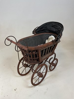 Lot 163 - A doll's pram and a rustic scratch built...