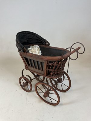 Lot 163 - A doll's pram and a rustic scratch built...