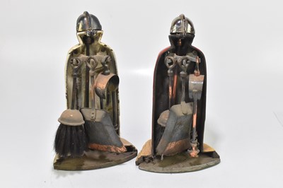 Lot 309 - Two novelty cast iron companion sets modelled as suits of armour