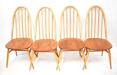 Lot 11 - ERCOL; an elm oval drop-leaf table, raised on...