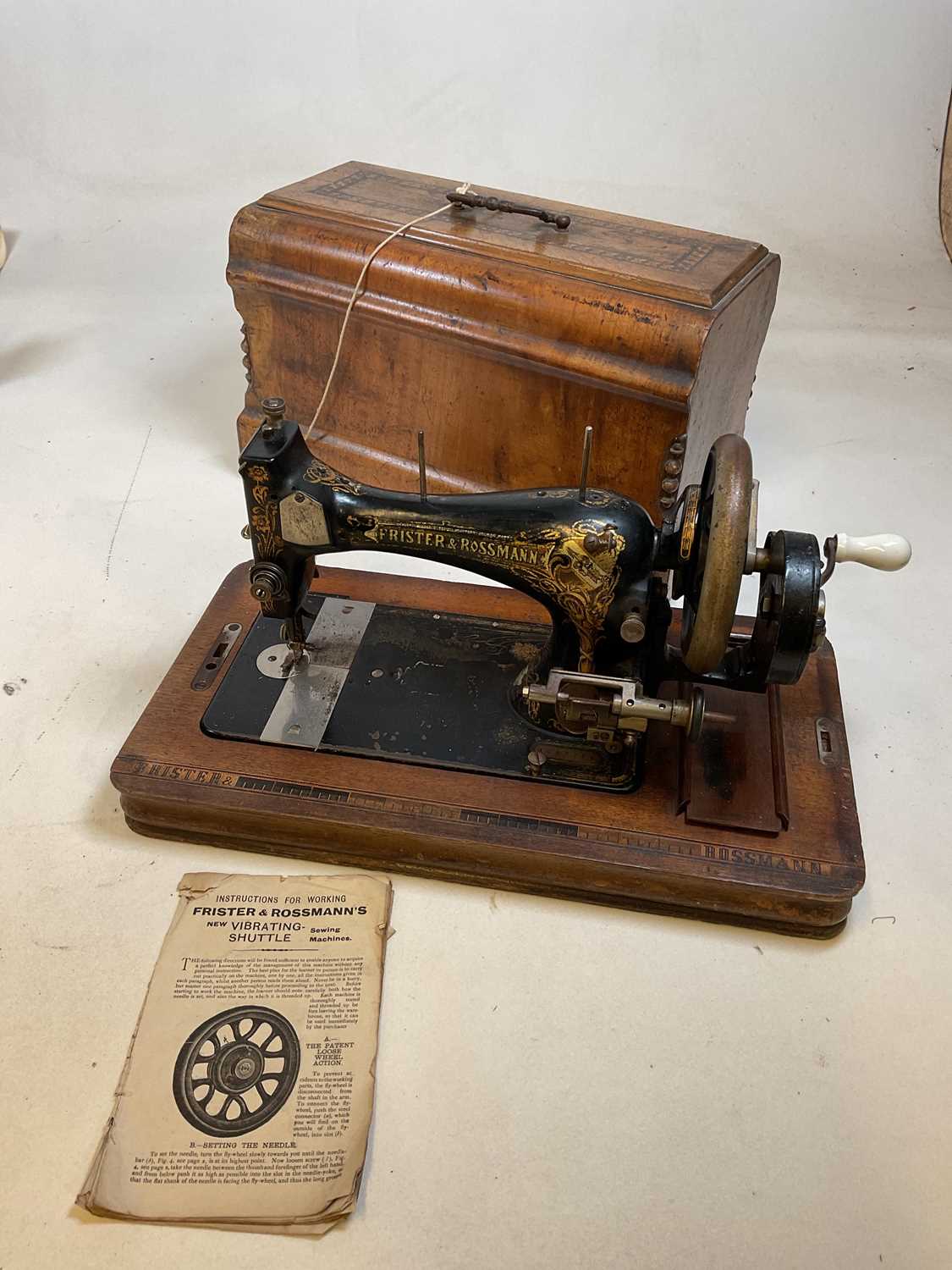 Lot 175 - A walnut cased sewing machine