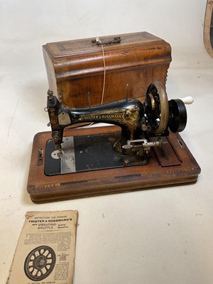 Lot 175 - A walnut cased sewing machine