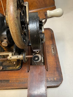 Lot 175 - A walnut cased sewing machine