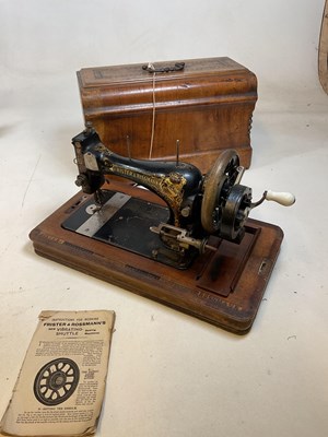 Lot 175 - A walnut cased sewing machine