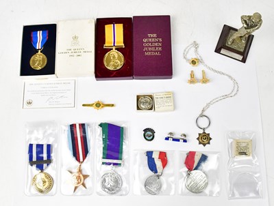 Lot 919 - A small collection of badges comprising two...