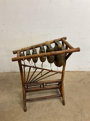 Lot 94 - A bamboo framed Chinese xylophone striking on...