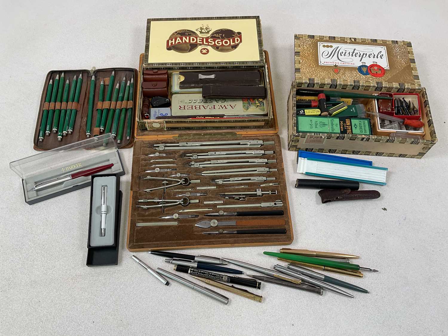 Lot 31 - A collection of pens, pencils and associated...