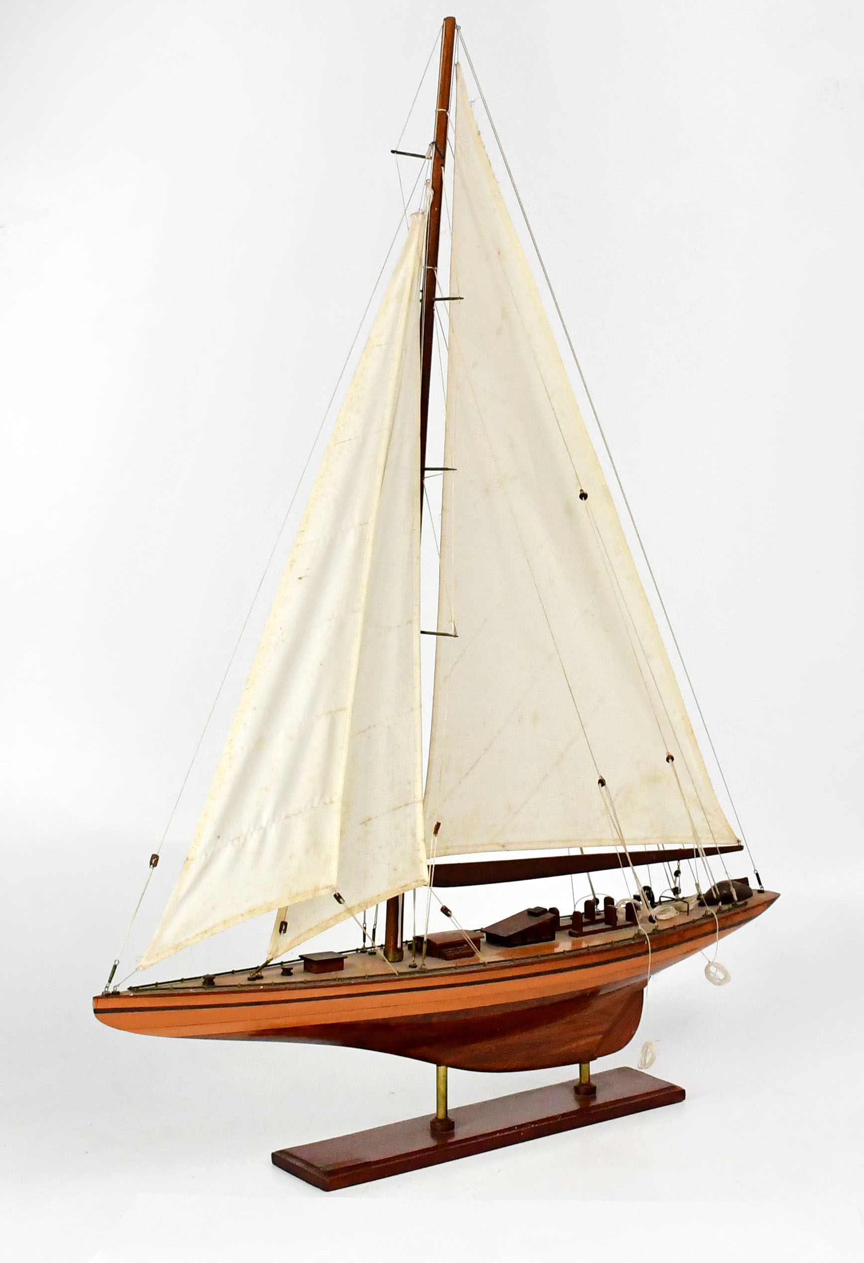 Single Ship Lot 232 - A model of a single-masted sailing ship,