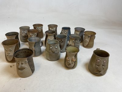 Lot 261 - A collection of "ugly mugs", 1970s pottery...