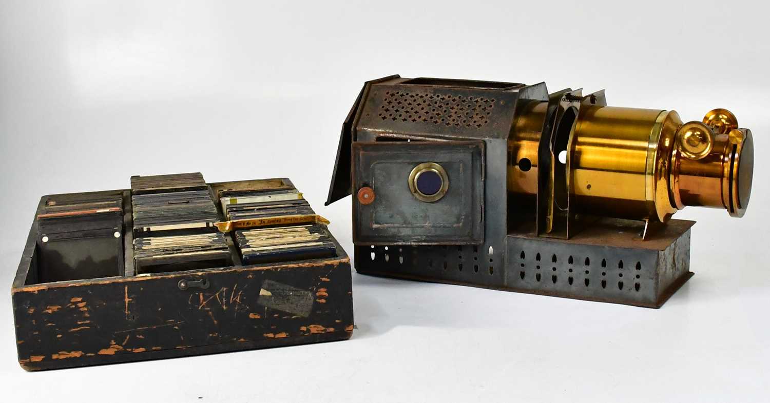 Lot 433 - A brass and metal cased magic lantern in metal...
