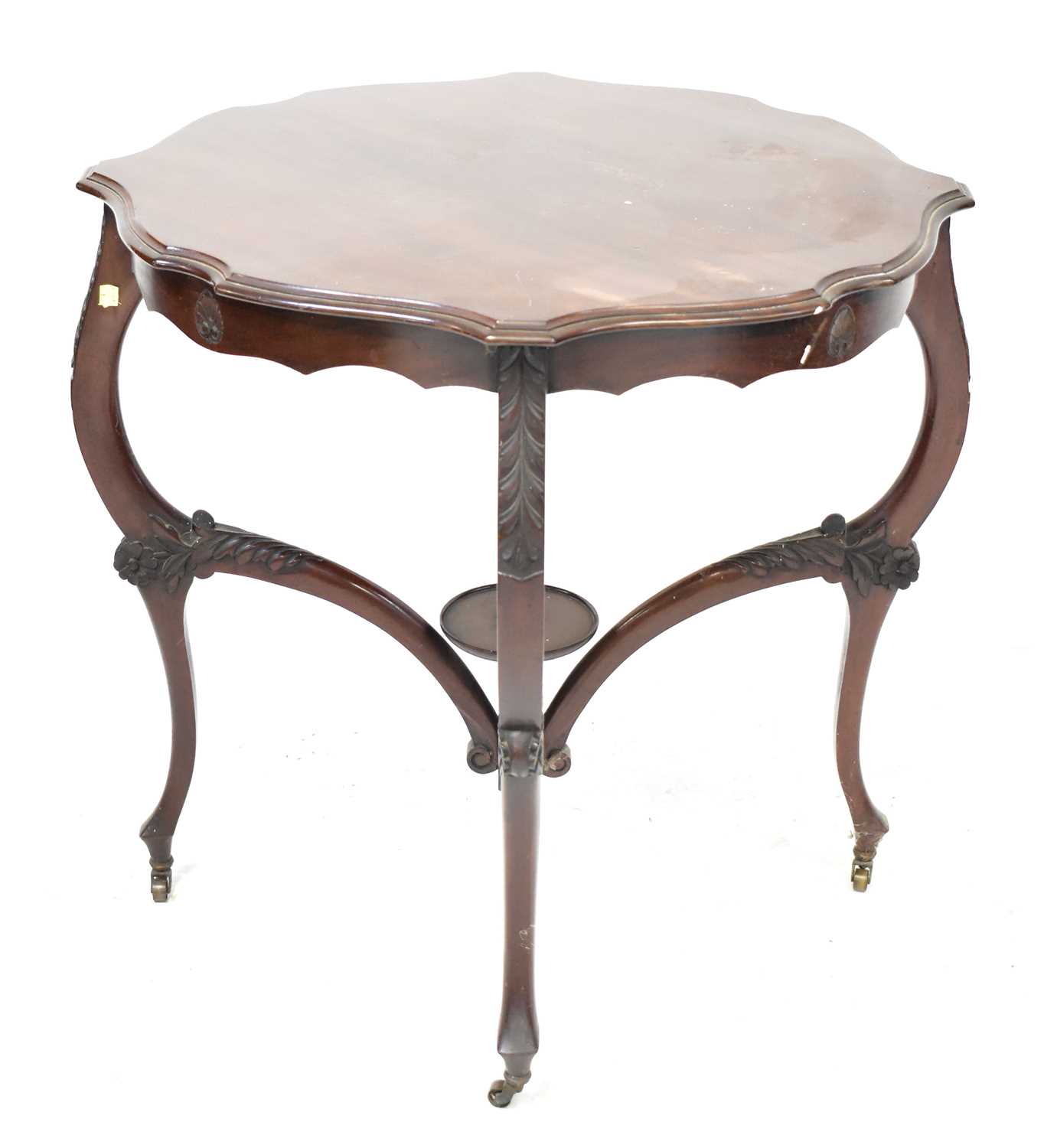 Lot 14 - A carved walnut side table with circular...
