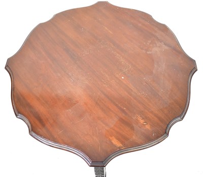Lot 14 - A carved walnut side table with circular...