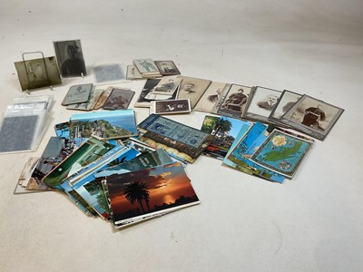 Lot 365 - A group of photographs and postcards.