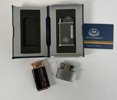 Lot 85 - THE ORIENT EXPRESS; a boxed lighter, with...