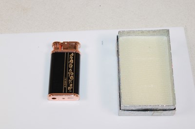 Lot 85 - THE ORIENT EXPRESS; a boxed lighter, with...