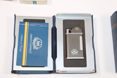 Lot 85 - THE ORIENT EXPRESS; a boxed lighter, with...
