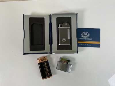 Lot 85 - THE ORIENT EXPRESS; a boxed lighter, with...