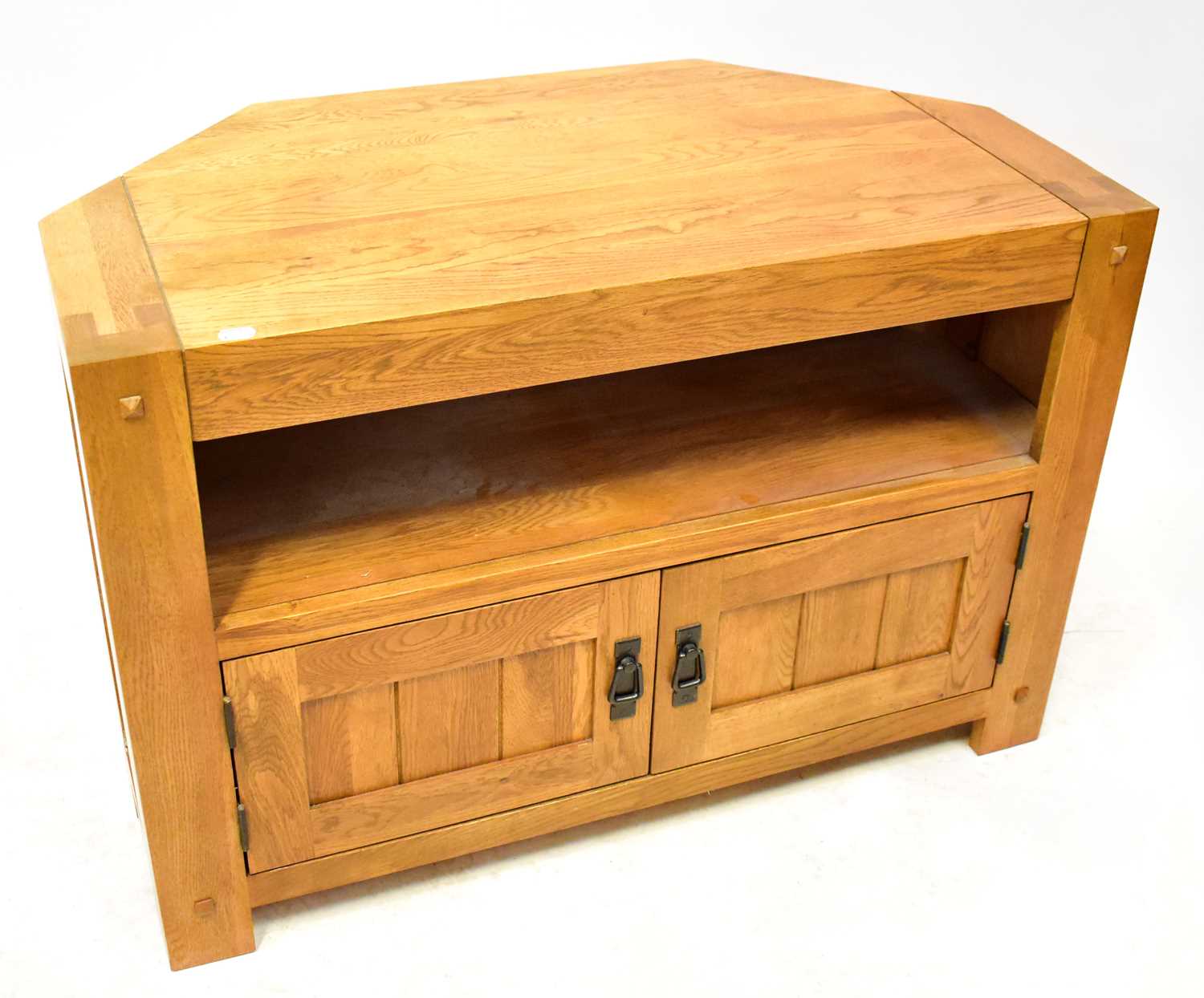 Lot 28 - An oak corner unit/television cabinet with a...