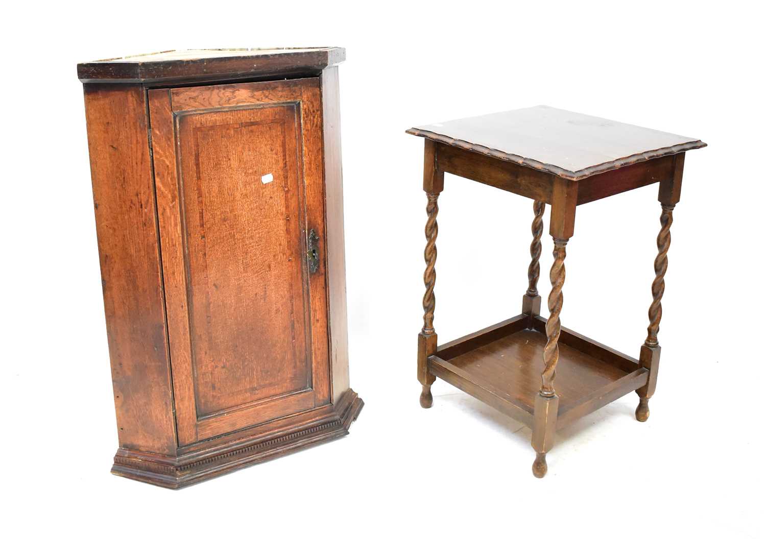 Lot 22 - A Georgian oak corner cupboard with dentil...