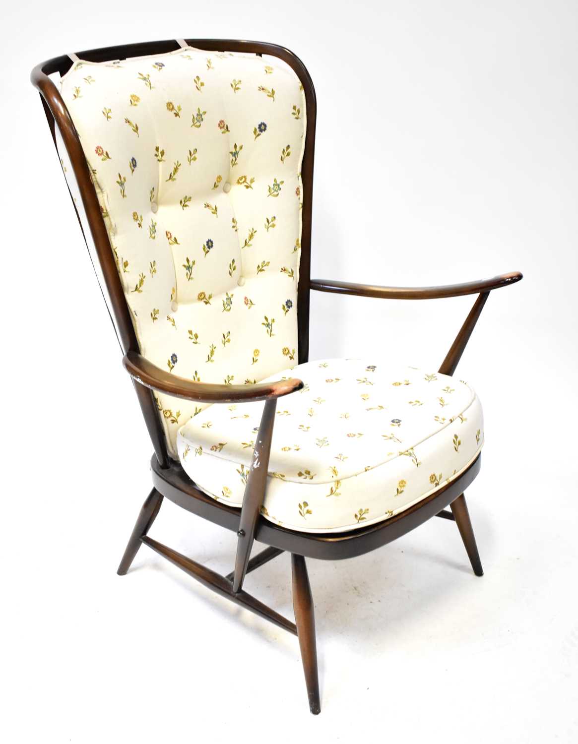 Lot 9 - ERCOL; a dark stained elm open arm chair with...