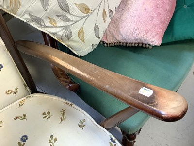 Lot 9 - ERCOL; a dark stained elm open arm chair with...