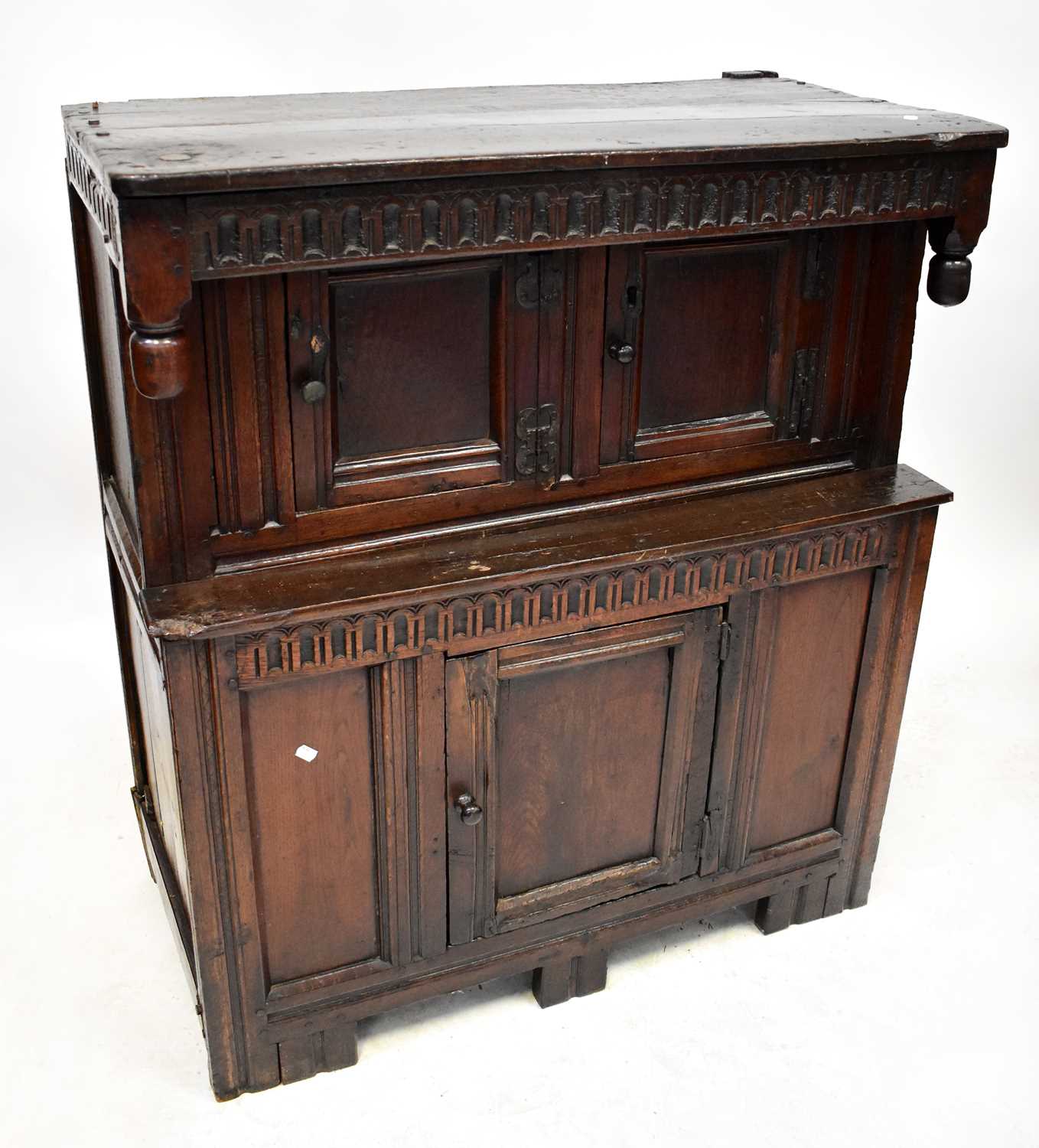 Lot 122 - A 17th century oak court cupboard of small...