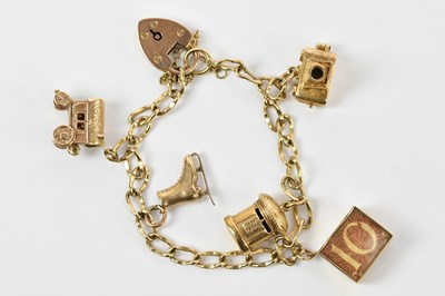 Lot 25 - A yellow metal bracelet, set with five 9ct...
