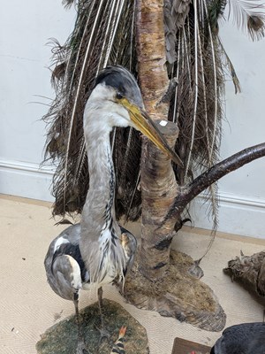 Lot 1367 - TAXIDERMY; a large model of a peacock perching...