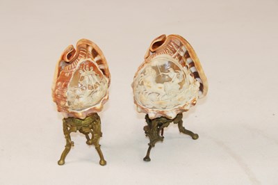 Lot 1249 - A pair of unusual carved conch shells mounted...