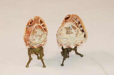 Lot 1249 - A pair of unusual carved conch shells mounted...
