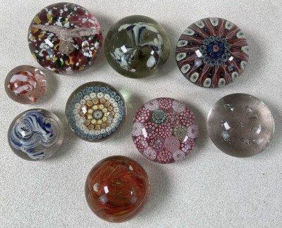 Lot 1161 - Nine vintage glass paperweights, including a...