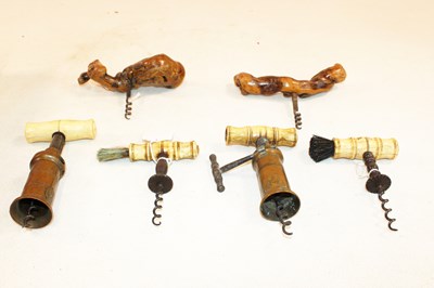 Lot 1004 - Four Victorian bone handled corkscrews, two...