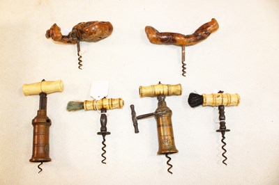 Lot 1004 - Four Victorian bone handled corkscrews, two...