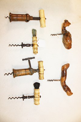 Lot 1004 - Four Victorian bone handled corkscrews, two...