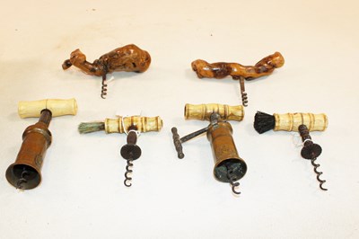 Lot 1004 - Four Victorian bone handled corkscrews, two...