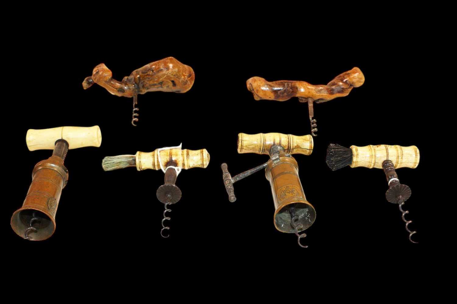 Lot 1004 - Four Victorian bone handled corkscrews, two...