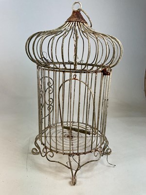 Lot 70 - A vintage wrought iron onion topped birdcage.