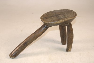 Lot 1139 - An Ashanti Ghanian carved African tribal stool,...