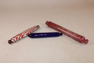 Lot 1157 - Three Victorian Nailsea type glass rolling...