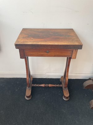 Lot 2179 - A 19th century rosewood fold-over swivel top...