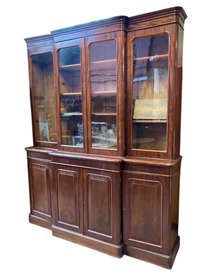 Lot 1162 - A Victorian mahogany breakfront bookcase, with...