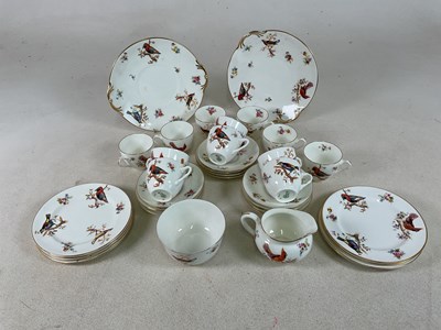 Lot 277 - ROYAL DOULTON; a bird and floral decorated tea...