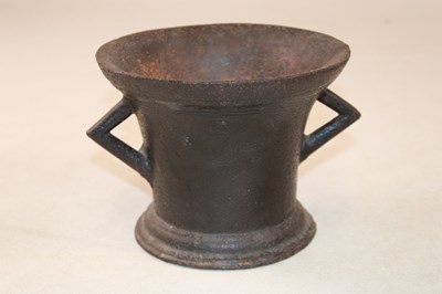 Lot 1132 - A 17th century cast iron mortar, width 21.5cm.