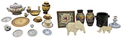 Lot 606 - GOUDA; a pair of Dutch art pottery baluster...