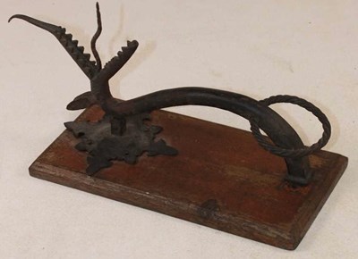 Lot 1134 - An Arts and Crafts door knocker modelled as a...