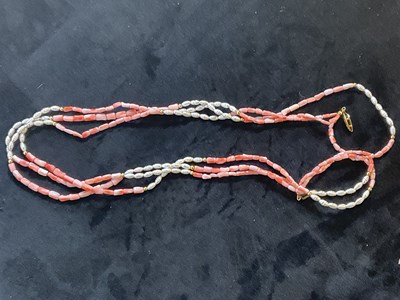 Lot 343 - A coral and pearl three strand necklace,...