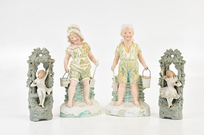 Lot 156 - GOSS & COMPANY; a pair of painted Parian ware...