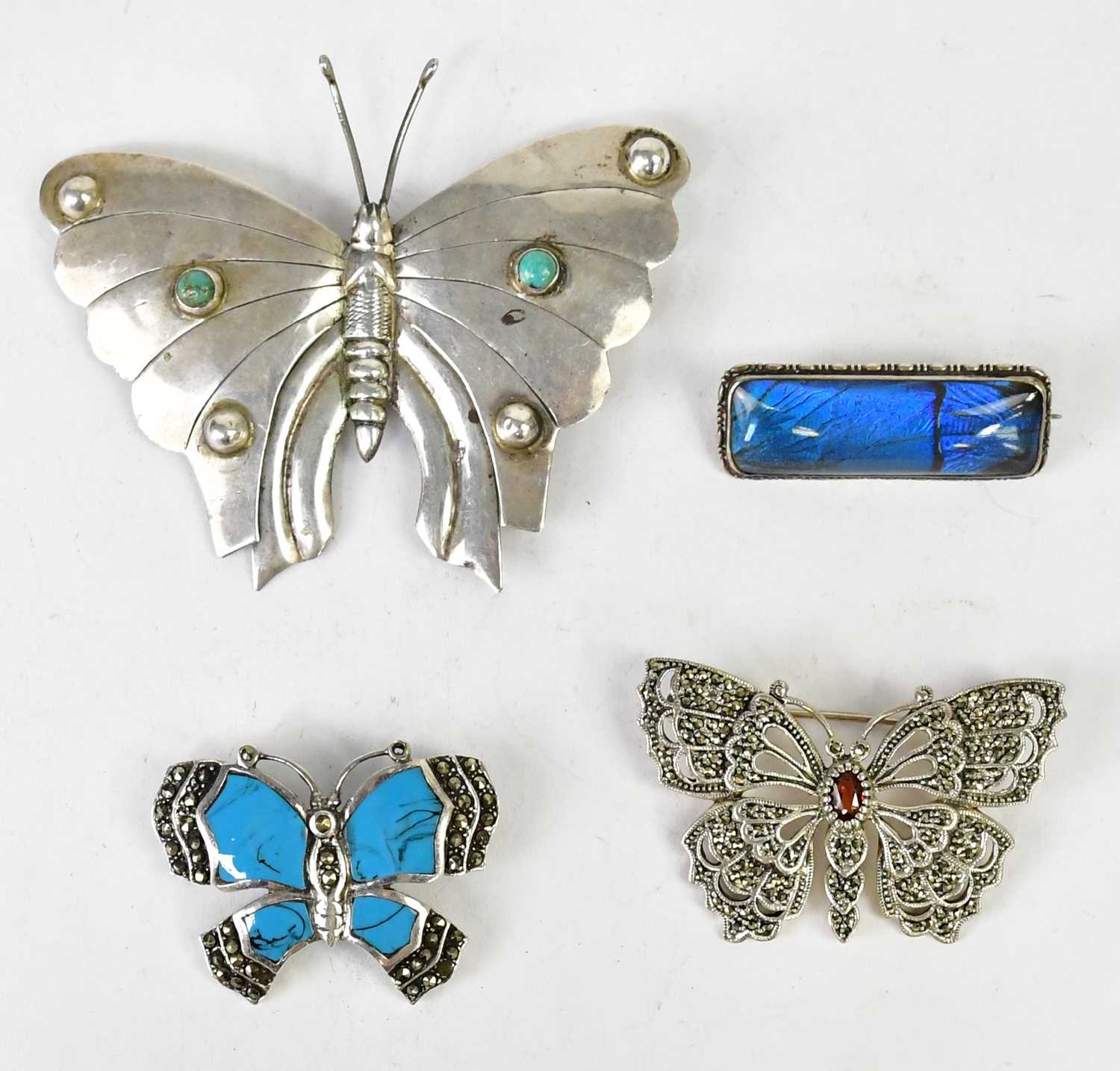 Lot 1068 - Three butterfly brooches, comprising a large...