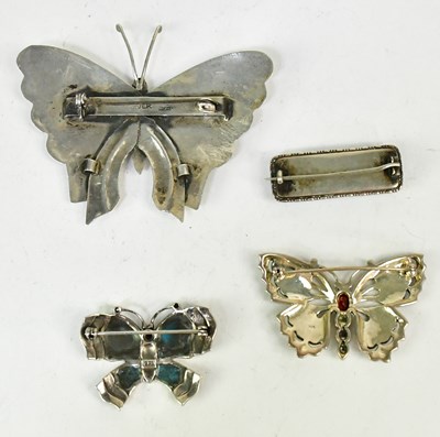 Lot 1068 - Three butterfly brooches, comprising a large...