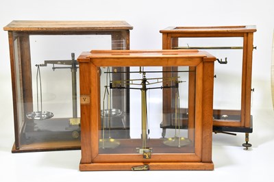 Lot 1458 - Three cased scientific balance scales,...